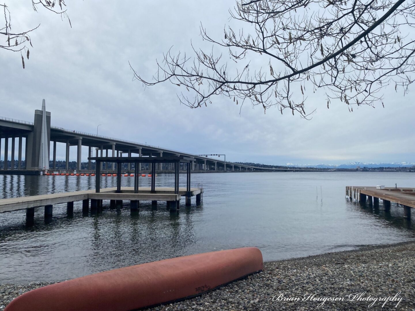 A dock with a boat on it and trees in the background